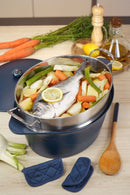 Delicious meal preparation in a cocotte with fish and vegetables, showcasing the L'Incroyable Cocotte de Cookut.