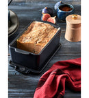 Terrine céramique Appolia 650g filled with delicious homemade terrine, served with figs and spices on a rustic wooden table.