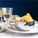 Faitout en inox 5-ply collection Castel’Pro avec couvercle, présenté sur une table élégante.